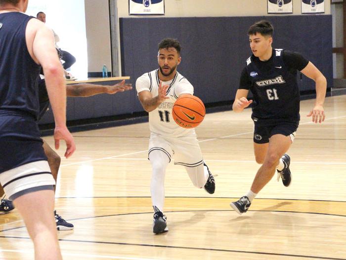 Penn State DuBois sophomore guard Kaleb Pryor drives toward the lane and passes the ball to a teammate during a recent basketball game at the PAW Center.