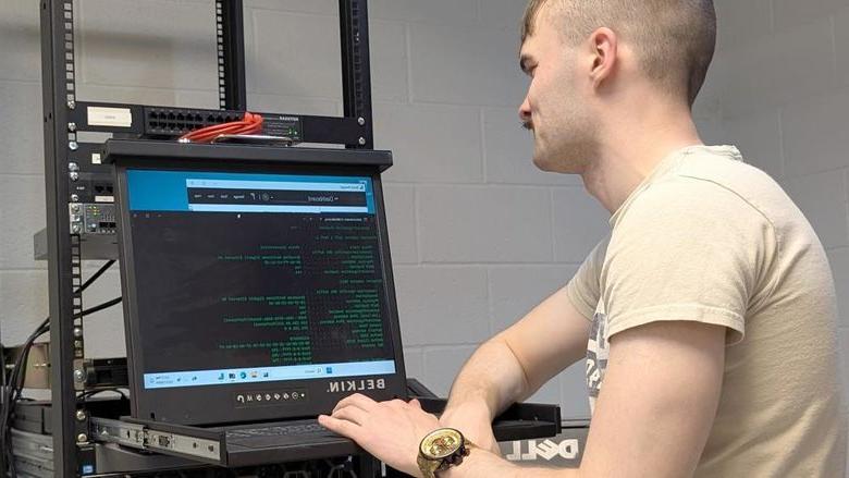 Penn State DuBois student Triston Kriner works through the set-up procedures for one of the enterprise-class virtualization servers that the campus received as part of a partnership with Penn State IT.