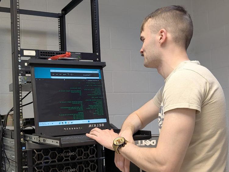 Penn State DuBois student Triston Kriner works through the set-up procedures for one of the enterprise-class virtualization servers that the campus received as part of a partnership with Penn State IT.